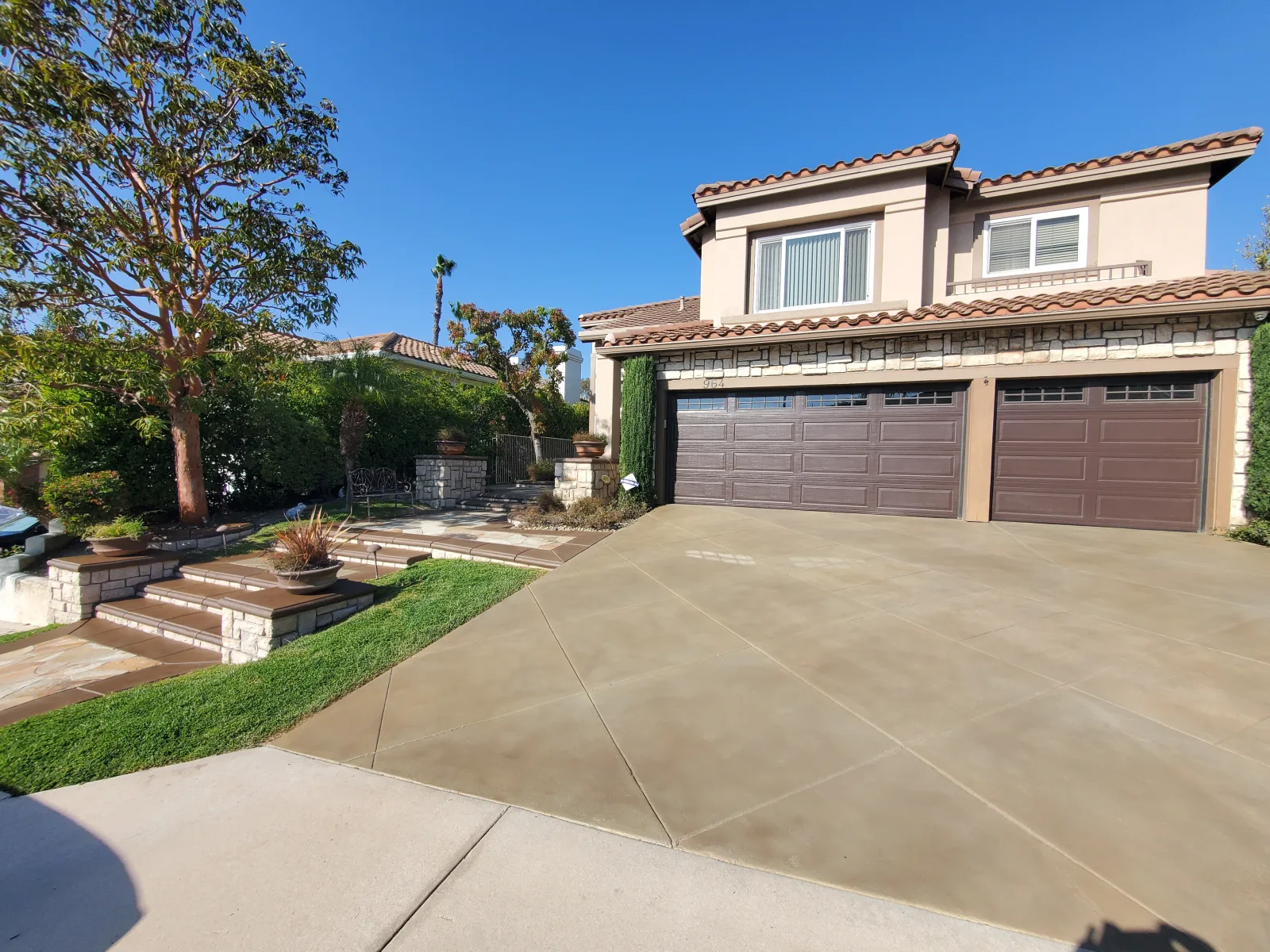 Large decorative driveway after staining and resealing