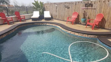Restored concrete patio and pool area after maintenance