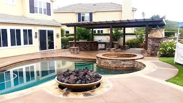 Travertine pool deck with outdoor kitchen cleaned and sealed in Orange County
